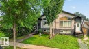 Stucco and stone facade property featuring multiple mature trees and a manicured lawn - 12219 89 Street Nw, Edmonton, AB  - Outdoor 