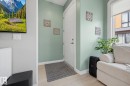Entryway featuring a white paneled door, light green wall tones, and light wood-finish flooring - #201 10625 Kingsway Av Nw, Edmonton, AB  - Indoor Photo Showing Other Room 