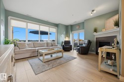 Living area featuring wood-finish flooring and light-toned walls - 
