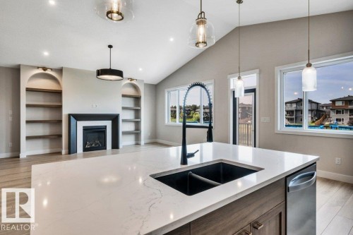 21 Norwyck Way, Spruce Grove, AB - Indoor Photo Showing Kitchen With Fireplace With Double Sink