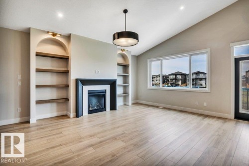 21 Norwyck Way, Spruce Grove, AB - Indoor Photo Showing Living Room With Fireplace