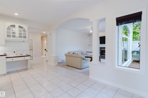 Bright interior featuring white tile flooring and white walls - 928 Heacock Road Nw, Edmonton, AB - Indoor