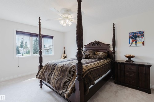 Bedroom featuring soft carpet flooring and white painted walls - 928 Heacock Road Nw, Edmonton, AB - Indoor Photo Showing Bedroom