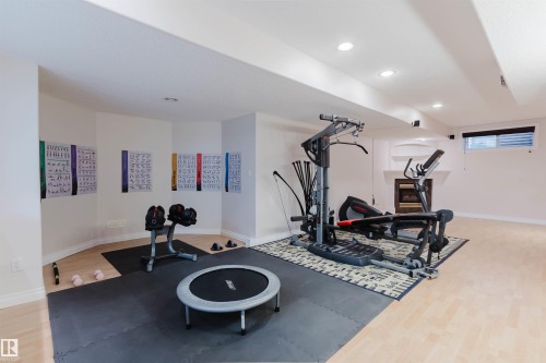 Lower level space featuring light wood-finish flooring and recessed lighting - 928 Heacock Road Nw, Edmonton, AB - Indoor Photo Showing Gym Room