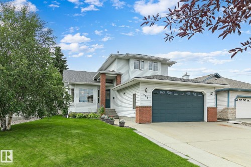 Two-story exterior with light-colored siding and brick accents - 385 Meadowview Terrace, Sherwood Park, AB - Outdoor With Facade