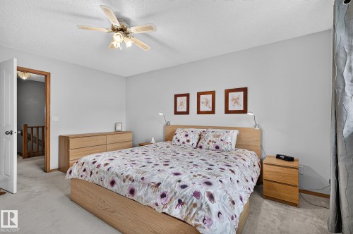 Primary bedroom suite featuring light-toned carpeting and neutral wall tones - 385 Meadowview Terrace, Sherwood Park, AB - Indoor Photo Showing Bedroom