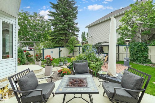 Gorgeous outdoor space includes a deck and a separate patio with a fire pit - 385 Meadowview Terrace, Sherwood Park, AB - Outdoor With Deck Patio Veranda With Exterior