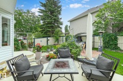 Gorgeous outdoor space includes a deck and a separate patio with a fire pit - 