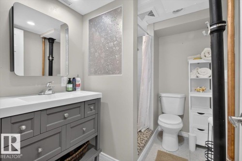 Contemporary bathroom featuring a vanity with gray cabinetry and a white countertop - 11934 43 Street Nw, Edmonton, AB - Indoor Photo Showing Bathroom