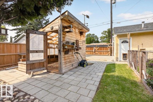 Detached wood-clad outbuilding with a clear panel roof - 11934 43 Street Nw, Edmonton, AB - Outdoor With Deck Patio Veranda