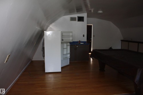 Hardwood-style flooring throughout - 5227 51 Street, Redwater, AB - Indoor Photo Showing Other Room