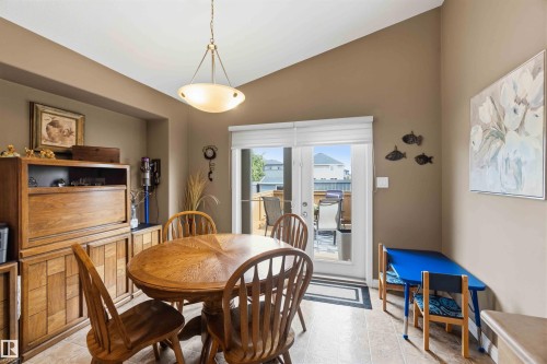 Dining area featuring a vaulted ceiling and tile flooring - 6320 166 Avenue Nw, Edmonton, AB - Indoor Photo Showing Dining Room