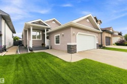 Single-family residence featuring a prominent front entrance with a covered porch and white columns - 