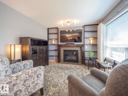 #42 450 Hyndman Cr Nw, Edmonton, AB - Indoor Photo Showing Living Room With Fireplace