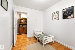 Hardwood flooring present in room and visible through doorway - 