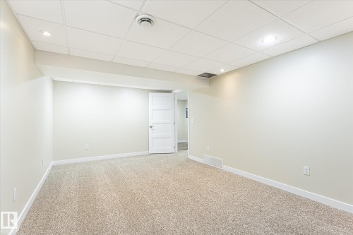 Room featuring light-toned carpeting, white walls, and a white drop ceiling with recessed lighting - 4921 47 Avenue, Legal, AB - Indoor Photo Showing Other Room