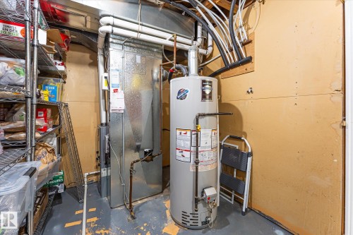 Utility area featuring a water heater and furnace - 4921 47 Avenue, Legal, AB - Indoor Photo Showing Basement