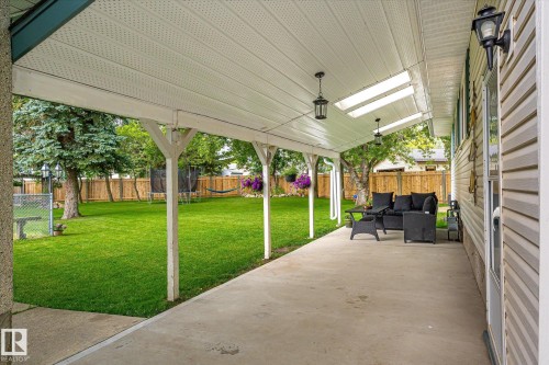 Covered concrete patio featuring white vinyl soffit and recessed lighting - 4921 47 Avenue, Legal, AB - Outdoor With Exterior