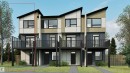 Modern townhome exterior featuring a pitched roofline, large windows, an upper-level balcony with glass railing, ground-floor entry, and a paved walkway - 2028 212 Street Nw, Edmonton, AB  - Outdoor With Balcony With Facade 