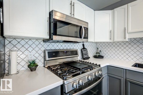 12114 16 Avenue Sw, Edmonton, AB - Indoor Photo Showing Kitchen With Upgraded Kitchen