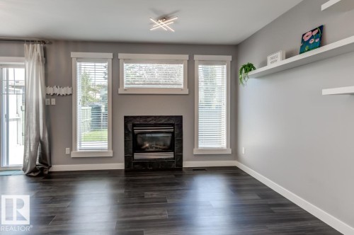 12114 16 Avenue Sw, Edmonton, AB - Indoor Photo Showing Living Room With Fireplace