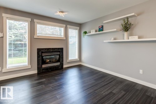 12114 16 Avenue Sw, Edmonton, AB - Indoor Photo Showing Living Room With Fireplace