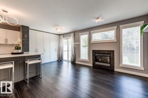 12114 16 Avenue Sw, Edmonton, AB - Indoor Photo Showing Living Room With Fireplace