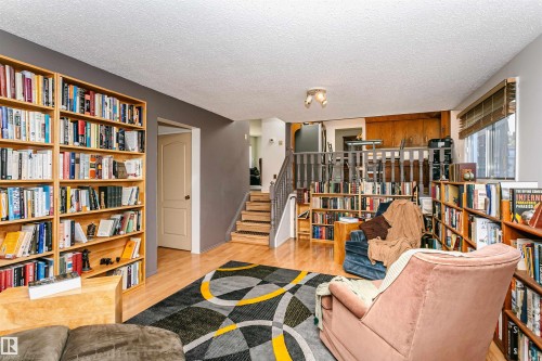 Hardwood-style flooring throughout the main living area - 18316 78 Avenue Nw, Edmonton, AB - Indoor
