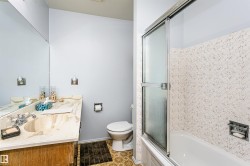 Bathroom featuring a built-in vanity with an integrated sink and a full-width mirror - 