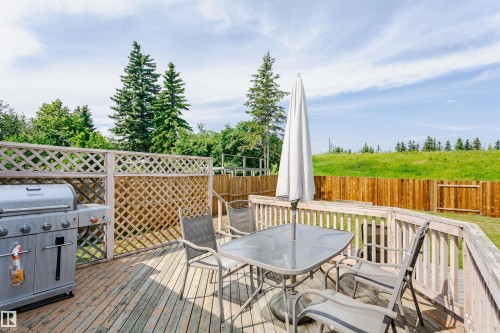Wood deck with lattice privacy screening and a wood fence - 18316 78 Avenue Nw, Edmonton, AB - Outdoor With Deck Patio Veranda