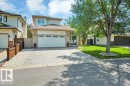Two-story residence featuring a two-car garage, complemented by a brick and siding exterior - 568 Buchanan Road Nw, Edmonton, AB  - Outdoor 