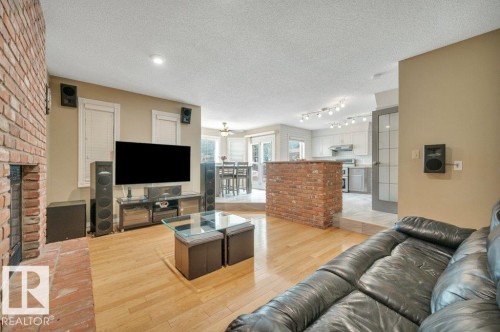 568 Buchanan Road Nw, Edmonton, AB - Indoor Photo Showing Living Room With Fireplace