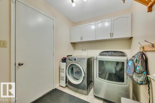 main floor laundry room with direct access to the double attached garage. - 568 Buchanan Road Nw, Edmonton, AB - Indoor Photo Showing Laundry Room