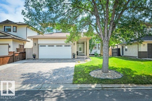 Brick and siding exterior with an attached two-car garage - 568 Buchanan Road Nw, Edmonton, AB - Outdoor