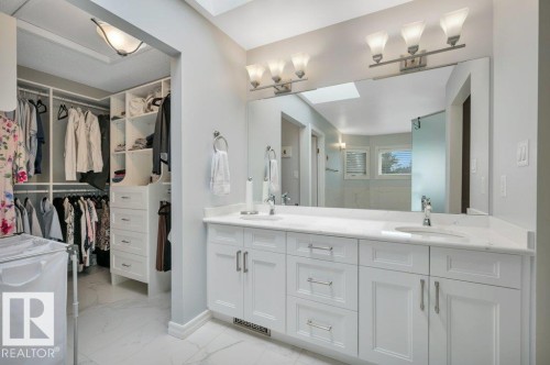 with walk-in closet and built-in closet organizers - 568 Buchanan Road Nw, Edmonton, AB - Indoor Photo Showing Bathroom