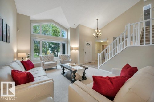 Living room featuring a vaulted ceiling - 568 Buchanan Road Nw, Edmonton, AB - Indoor Photo Showing Living Room