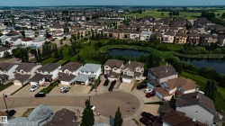 Residential development featuring a mix of single-family homes and multi-story dwellings - 