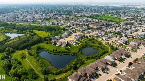 Aerial perspective showcasing a property bordered by natural green spaces and bodies of water - 715 Wildwood Point(E) Nw, Edmonton, AB - Outdoor With View
