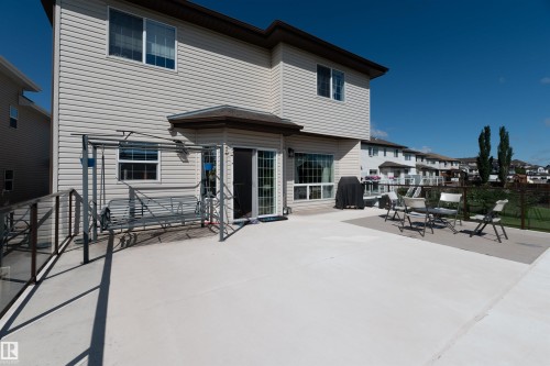 Expansive concrete patio with a ramp entry, offering a large outdoor living area - 715 Wildwood Point(E) Nw, Edmonton, AB - Outdoor With Exterior