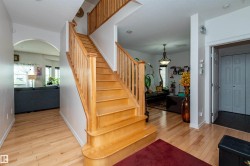 Hardwood staircase with natural wood railings - 