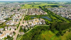 Aerial perspective showcasing a residential neighborhood with varied housing styles - 