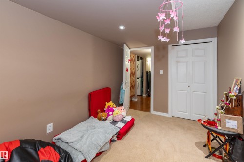 Room featuring neutral-toned walls, recessed lighting, and carpet flooring - 715 Wildwood Point(E) Nw, Edmonton, AB - Indoor Photo Showing Bedroom
