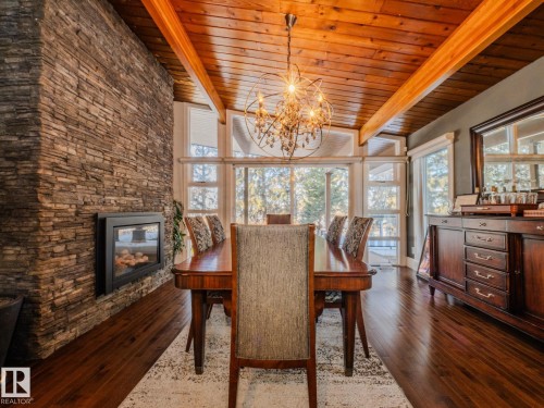 #80 23333 Wye Rd, Rural Strathcona County, AB - Indoor Photo Showing Dining Room With Fireplace
