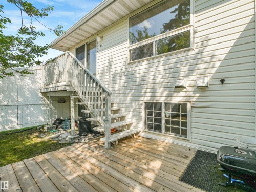 Exterior deck featuring wood flooring and railings - #2 3311 58 St Nw, Edmonton, AB - Outdoor With Deck Patio Veranda With Exterior