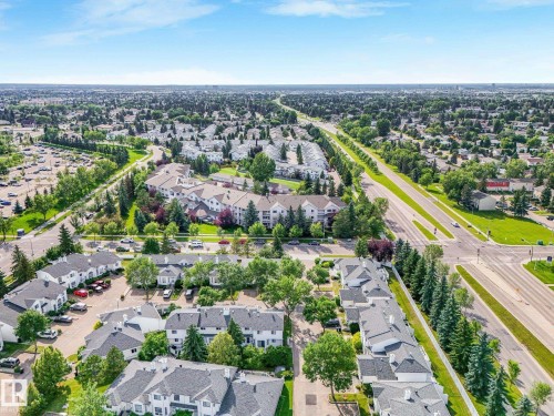 Aerial perspective showcasing the residential community with established landscaping and mature trees - #2 3311 58 St Nw, Edmonton, AB - Outdoor With View