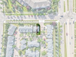 Aerial perspective highlighting a property with mature tree cover and a private driveway - 