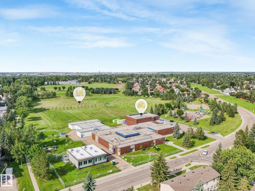 Expansive green spaces featuring manicured fields and mature trees - #2 3311 58 St Nw, Edmonton, AB - Outdoor With View