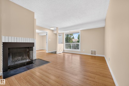 #104 2204 118 St Nw, Edmonton, AB - Indoor Photo Showing Living Room With Fireplace