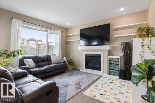 12831 205 Street Nw, Edmonton, AB - Indoor Photo Showing Living Room With Fireplace