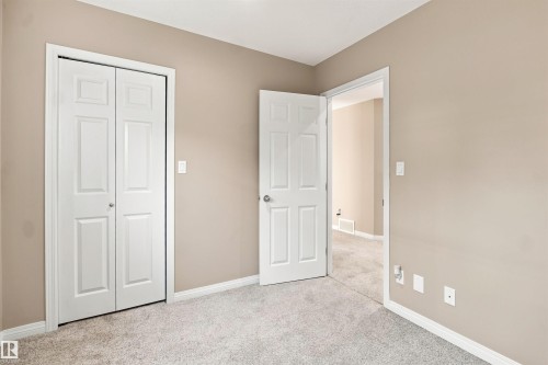 Neutral-toned walls complement light gray carpet flooring - 1328 80 Street Sw, Edmonton, AB - Indoor